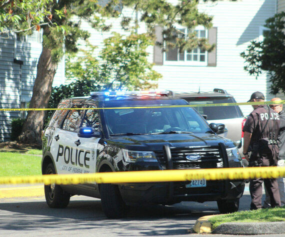 Federal Way police officers investigate a crime scene. File photo