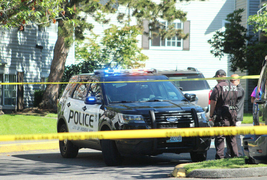 <p>Federal Way police officers investigate a crime scene. File photo</p>