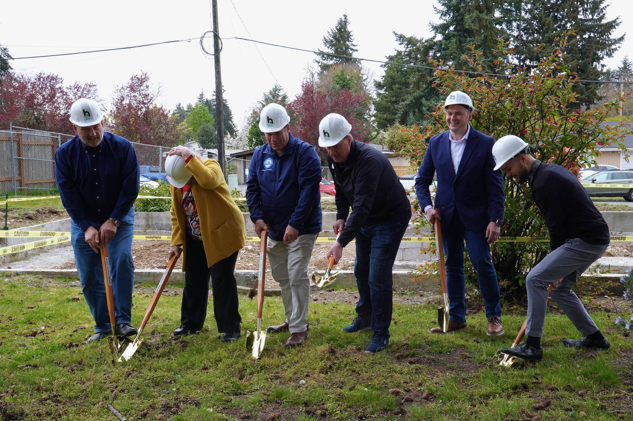 David Harrison, alongside other Fusion partners digging into the ground at their future duplex on April 11, 2024. Photo by Joshua Solorzano/ Federal Way Mirror