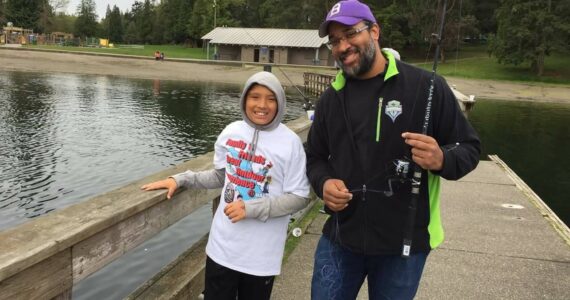 Participants fish from the dock at Steel Lake Park in Federal Way. File photo