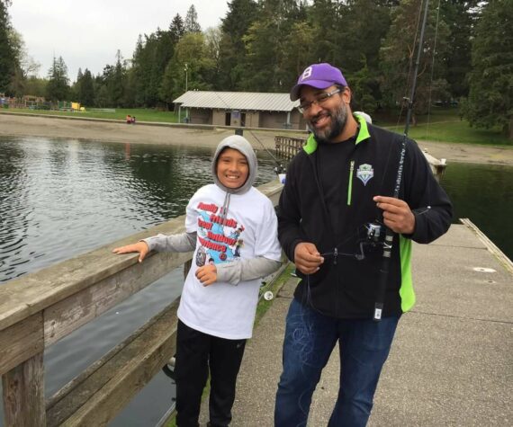 Participants fish from the dock at Steel Lake Park in Federal Way. File photo