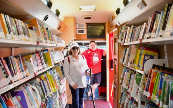 Federal Way City Councilmember Susan Honda tours a mobile library May 11 at the annual Touch-A-Truck event at the Federal Way Community Center. Photo courtesy of Bruce Honda