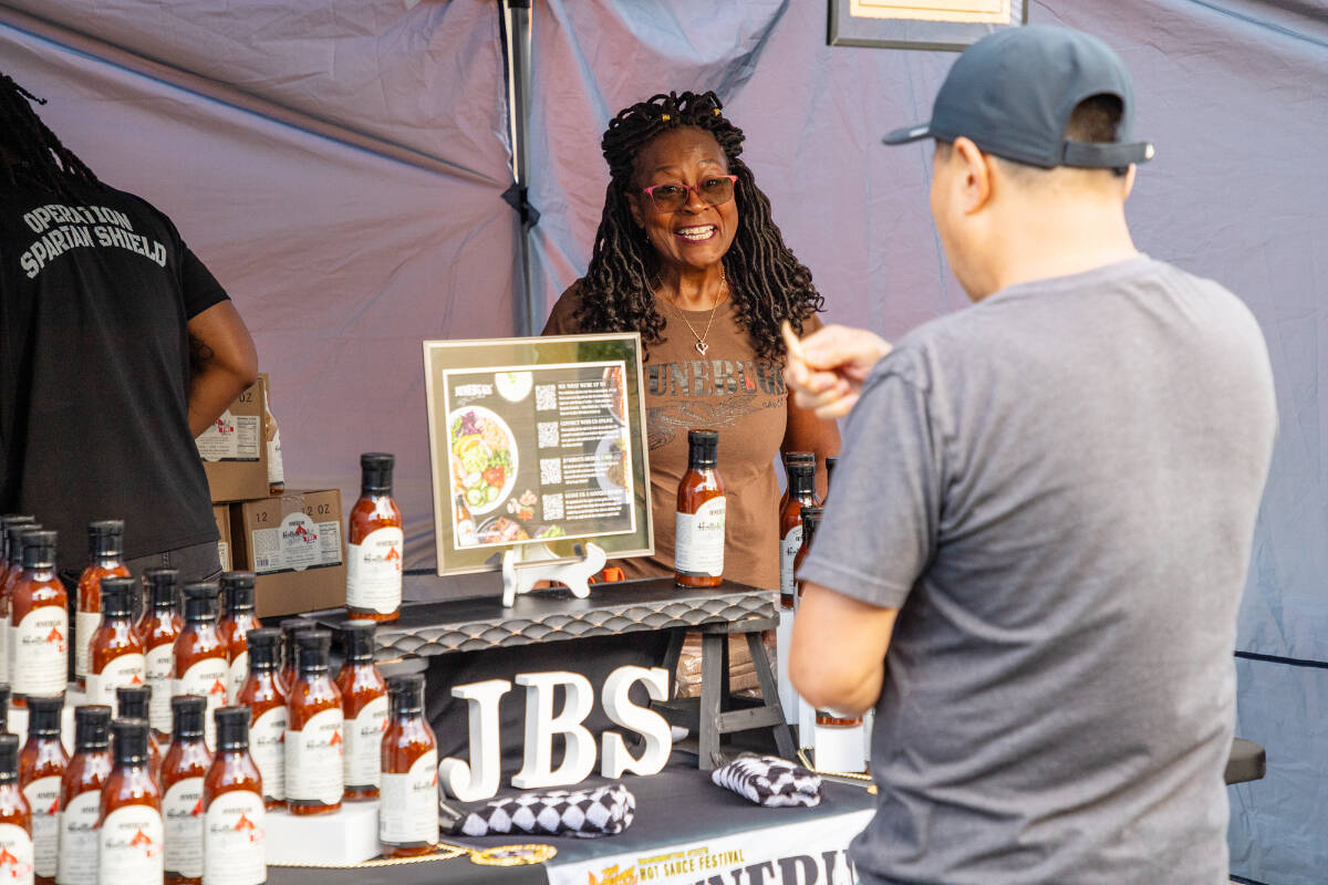 Gail Thompson, owner of Junebug’s Sauce, sets up shop at the Kent Farmer’s Market. Madison Kirkman/Comcast photo