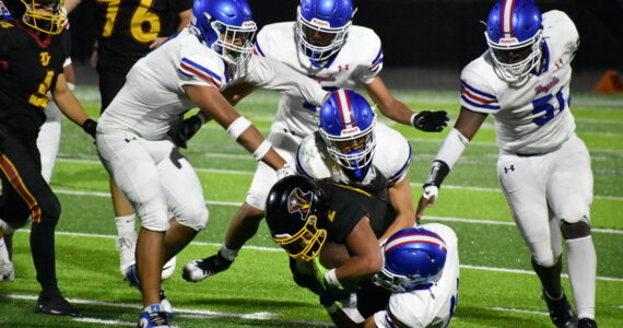 Gabriel Lamelle is swarm tackled by Kent-Meridian players. Ben Ray / The Mirror