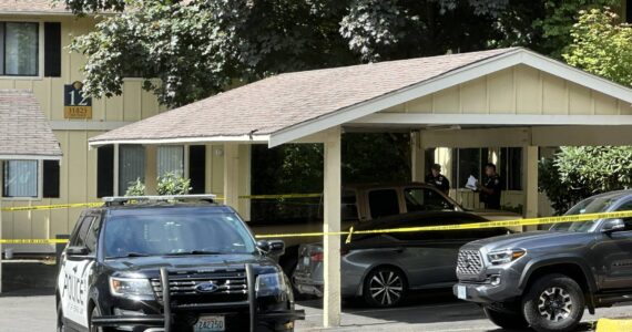 Caution tape and Federal Way police officers at The Shores Apartments on Aug. 18. Photo by Joshua Solorzano/The Mirror