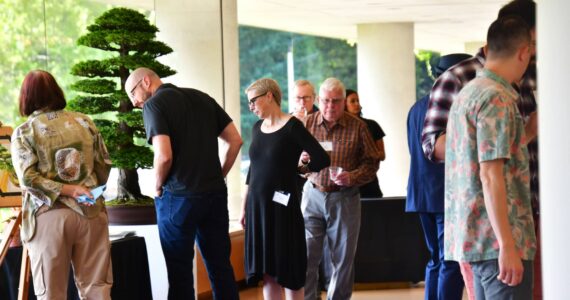Guests enjoy viewing bonsai at the Pacific Bonsai Museum fundraiser Branch Out on Sept. 28. The event was held at the former headquarters building of the Weyerhaeuser Corporation. Photo by Bruce Honda