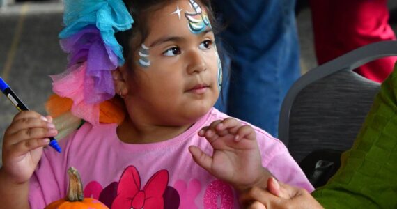 Guests of all ages enjoyed hands-on activities like pumpkin decorating and face painting at the Fall Festival on Saturday, Oct. 4. Photo by Bruce Honda