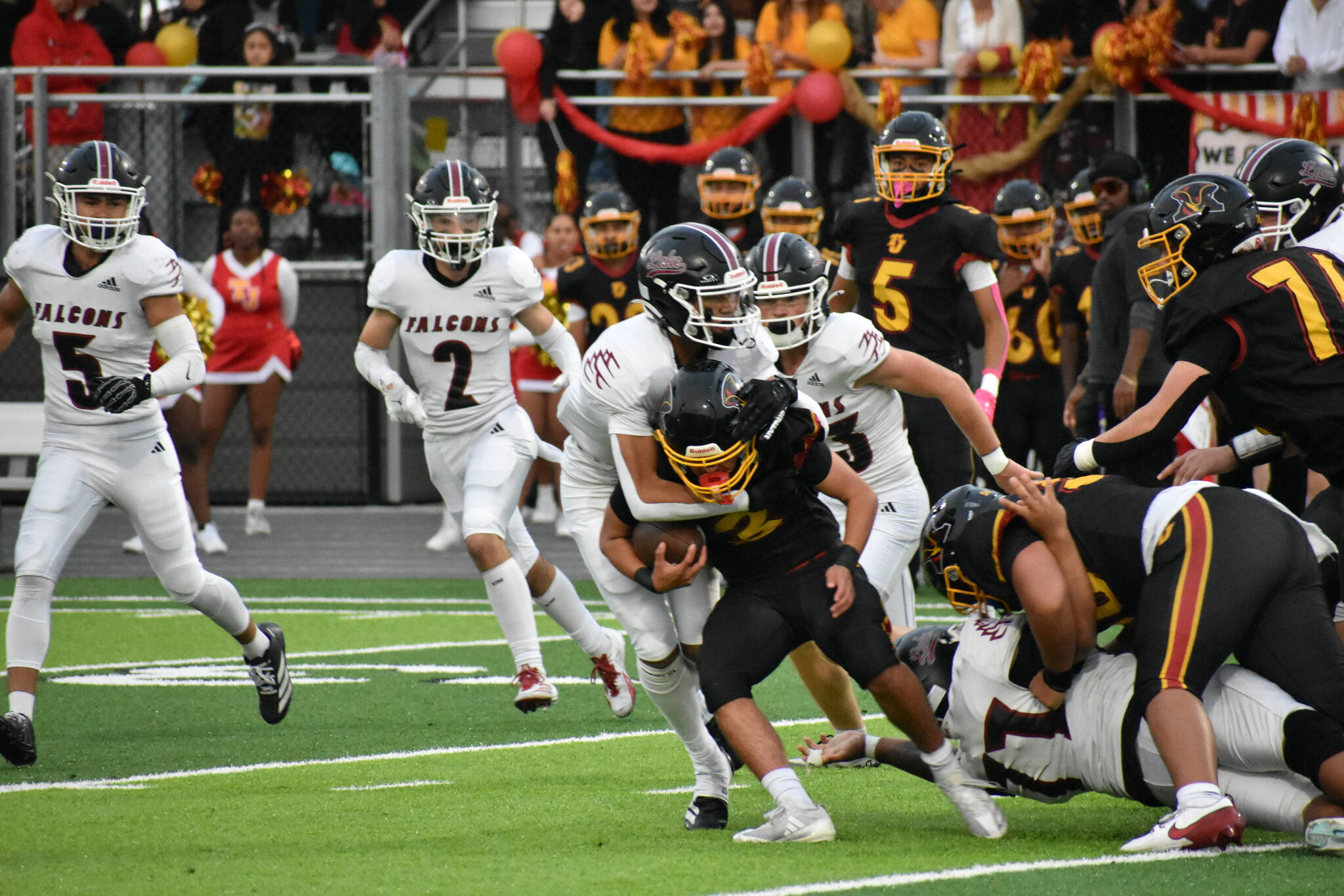 Kentlake defense wraps up Mabin Guillen. Nathan Hyun / The Mirror