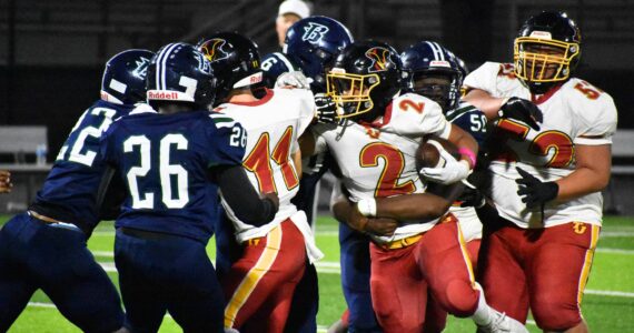 Gabriel Lemelle fights through contact against Todd Beamer. Ben Ray / The Mirror