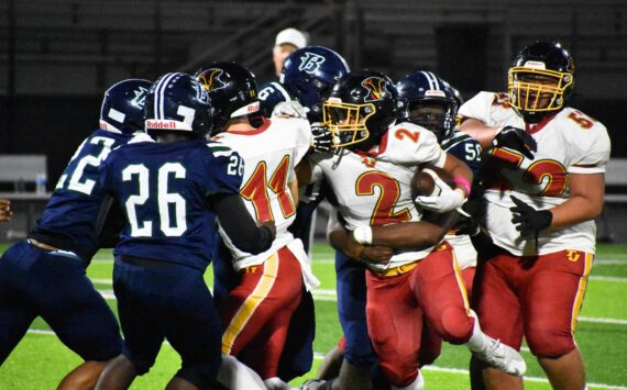 Gabriel Lemelle fights through contact against Todd Beamer. Ben Ray / The Mirror