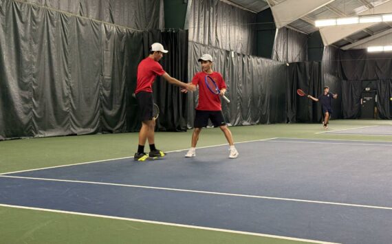 Raiders’ Vincent Pham and Dante Pham high five after point. Photo by Nathan Hyun