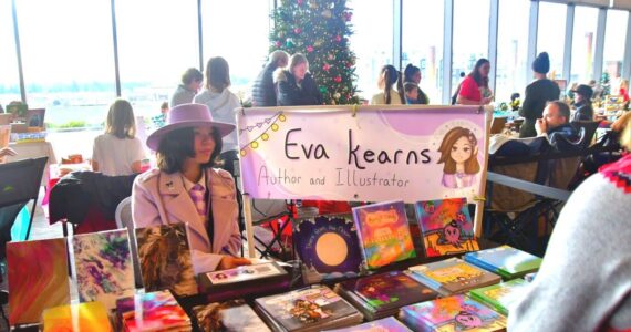 This year’s annual Holiday Festival at the Federal Way Performing Arts and Event Center featured a kids market, where young people in the community shared and sold their creations, like this local author and illustrator. Photo by Bruce Honda.