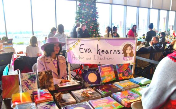 This year’s annual Holiday Festival at the Federal Way Performing Arts and Event Center featured a kids market, where young people in the community shared and sold their creations, like this local author and illustrator. Photo by Bruce Honda.