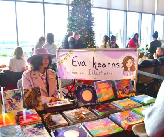 This year’s annual Holiday Festival at the Federal Way Performing Arts and Event Center featured a kids market, where young people in the community shared and sold their creations, like this local author and illustrator. Photo by Bruce Honda.