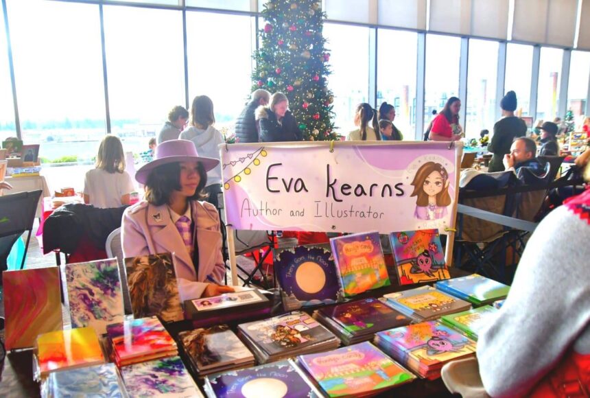 <p>This year’s annual Holiday Festival at the Federal Way Performing Arts and Event Center featured a kids market, where young people in the community shared and sold their creations, like this local author and illustrator. Photo by Bruce Honda.</p>