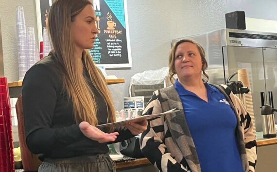 The Federal Way Community Center’s Sabrina Bates, inclusion coordinator, and Brittany Marth, inclusion assistant, talk about the city’s programs for people with disabilities during the Federal Way Mirror’s Hot off the Presses community conversation Dec. 9 at Poverty Bay Cafe. Staff photo