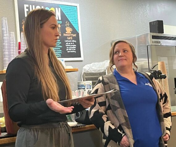 The Federal Way Community Center’s Sabrina Bates, inclusion coordinator, and Brittany Marth, inclusion assistant, talk about the city’s programs for people with disabilities during the Federal Way Mirror’s Hot off the Presses community conversation Dec. 9 at Poverty Bay Cafe. Staff photo