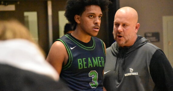 Doni Burkett and Todd Beamer head coach Brent Brilhante talk at the end of the game. Ben Ray / The Mirror