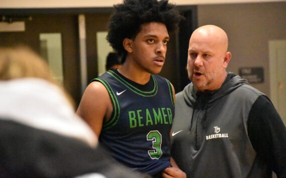 Doni Burkett and Todd Beamer head coach Brent Brilhante talk at the end of the game. Ben Ray / The Mirror