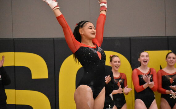 Rylee Cabang salutes after her bar routine. Ben Ray / The Mirror