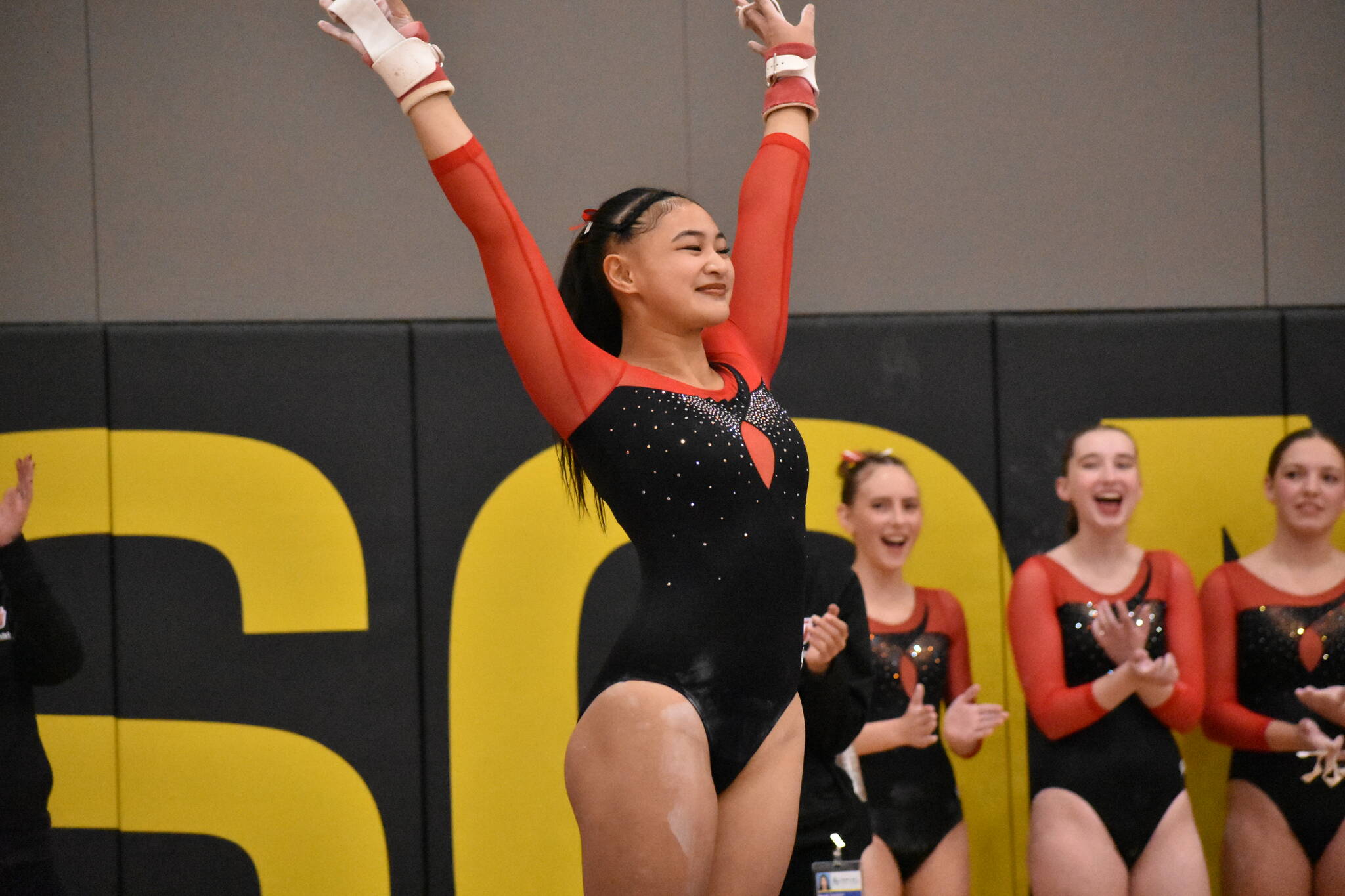 Rylee Cabang salutes after her bar routine. Ben Ray / The Mirror