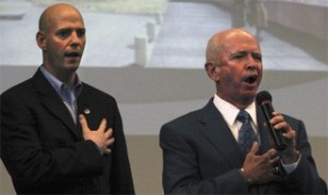 David Beamer sings the national anthem May 12 while Scott Haines