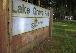 Children play at Lake Grove Park on Wednesday afternoon. The park