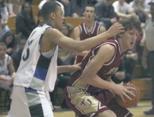 Thomas Jefferson High School center Spencer Hicks makes a move against Federal Way junior Cole Dickerson during Saturday’s win by the Eagles. Dickerson led Federal Way with 20 points against the Raiders. The win moved the Eagles to 9-1 on the season and 6-1 in the SPSL North. The loss droped TJ to 4-5.