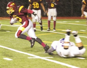 Thomas Jefferson running back Michael Sallee breaks through the Kent-Meridian defense during Friday’s 52-7 win at French Field. The victory was the first of the season for TJ.