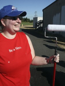 Nearly a dozen employees from Lowe’s Home Improvement in Federal Way painted four portable classrooms at Sherwood Forest Elementary School. The Aug. 25 project was part of an annual grant the store awards to a local school. Pictured: Sarah Warner.