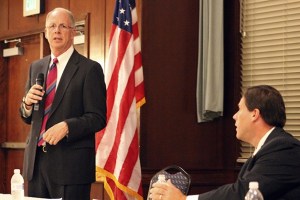 Mayor Skip Priest (left) speaks during a debate with Deputy Mayor Jim Ferrell on Oct. 9 at Twin Lakes Golf and Country Club.