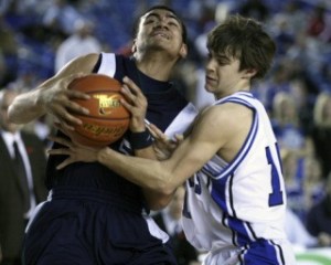 Beamer sophomore Napa Mefi drives to the basket during Wednesday's opener-round loss to Walla Walla at the Class 4A Boys Basketball Tournament inside the Tacoma Dome. The Titans dropped both of their games in their first appearance at the state tournament