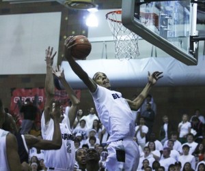 Todd Beamer High School senior Kevin Davis goes up for a rebound during Tuesday's 70-63 win over the ninth-ranked Decatur Gators. Davis finished with 30 points and 17 rebounds during the Titan win.