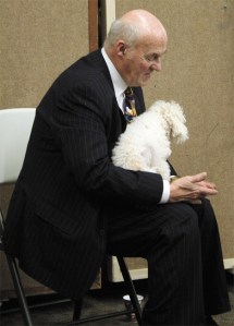 Author Richard LeMieux listens to others speak about the plight homeless men and women face every day during a Nov. 7 fundraising event for Reach Out