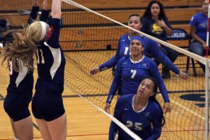 Federal Way players look on as Christian Faith players attempt to block the ball at the net. Federal Way won their Sept. 8 matchup 3-1.
