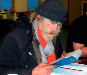 A homeless man reads at New Hope Church in Federal Way