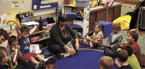 Students in Ms. Keeney's preschool class sing a song while learning about shapes and creating a cartoon man out of those shapes.
