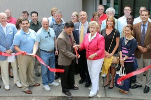 Sen. Mark Miloscia and Rep. Linda Kochmar cut a ribbon during the celebration of their new joint office on July 14.