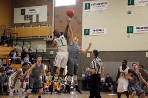 Patrick Kennedy wins the tip-off for the Titans at the start of their 55-47 win over Rogers on Jan. 2 at Todd Beamer High School.