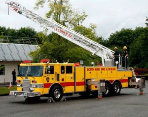 South King Fire and Rescue firefighters in 2012 test the oldest ladder truck (1981) in the fleet at Station 62 on South 312th Street. Fire district officials hope to replace aging vehicles and equipment.