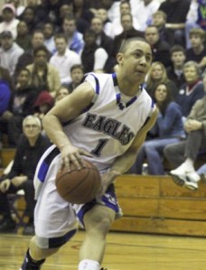 Federal Way High School junior guard Isiah Umipig drives to the basket during the Eagles' 59-54 win over Curtis in the West Central District semifinal Wednesday at Puyallup High School. Federal Way will take on Foss in the district championship at 6 p.m. at Puyallup Saturday.