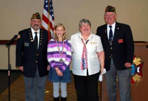 The local chapter of the Veterans of Foreign Wars recently recognized Enterprise Elementary fifth-grader Abbie Wolf (second from left) with a second place award for her essay on “How I Can Make a Difference in the World.”