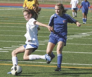 Federal Way High School junior forward Corsica Parker takes a shot during a 5-0 win over Kent-Meridian Tuesday at Federal Way Memorial Stadium. The win was the Eagles' first of the season.