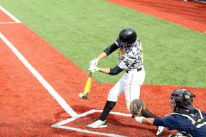 Timberline’s Tony Ortiz makes contact with a pitch. Ortiz hit a two-run inside-the-park home run in the game.