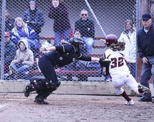 Thomas Jefferson's Reno Whitcomb is tagged out by Inglemoor's catcher during Saturday's opening round game at the Class 4A state softball tournament at the South End Recreation Center in Tacoma. The Raiders lost two-straight games at state.