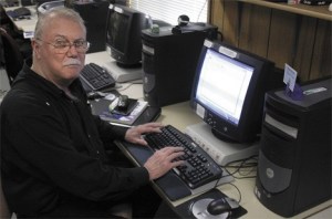 Monte Ferrell learns how to put a signature on an email March 9 at the Federal Way Senior Center.