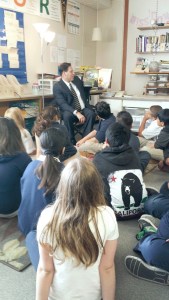 Mayor Jim Ferrell reads to Sheena Downs’s fifth grade class at Olympic View Elementary on Wednesday morning. He said the kids were excited and surprised that he visited their classroom.