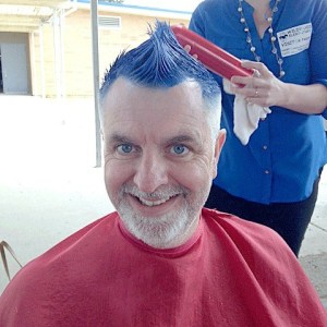 Wildwood Elementary principal Michael Swartz gets a mohawk makeover recently as part of a student challenge.