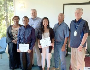 Kiwanis Club officials present scholarships to this year’s recipients