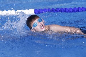Twin Lakes Swim Team's Andy Olson swims the freestyle leg of the boy's 9-10 100 medley relay during their meet Thursday against Normandy Park.
